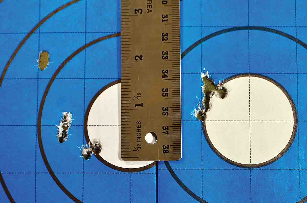 Two groups were shot at 35 yards using SIG hunting ammunition in the Ruger Hawkeye with and without the muzzle brake. The group on the left shot with the brake measures 2.26 inches with oblong bullet holes. The group on the right shot without the brake measures .775 inch, and the bullet holes are perfect.